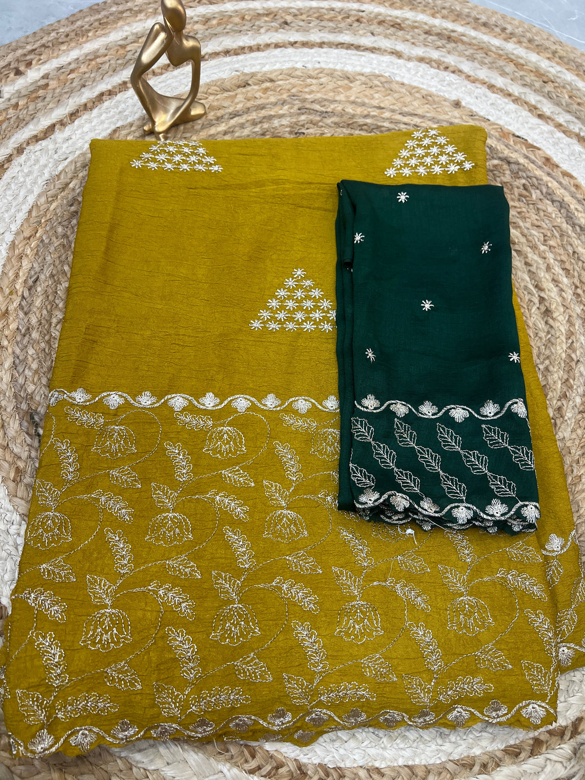 Mustard green embroidered saree with cutwork border and deep green contrast blouse